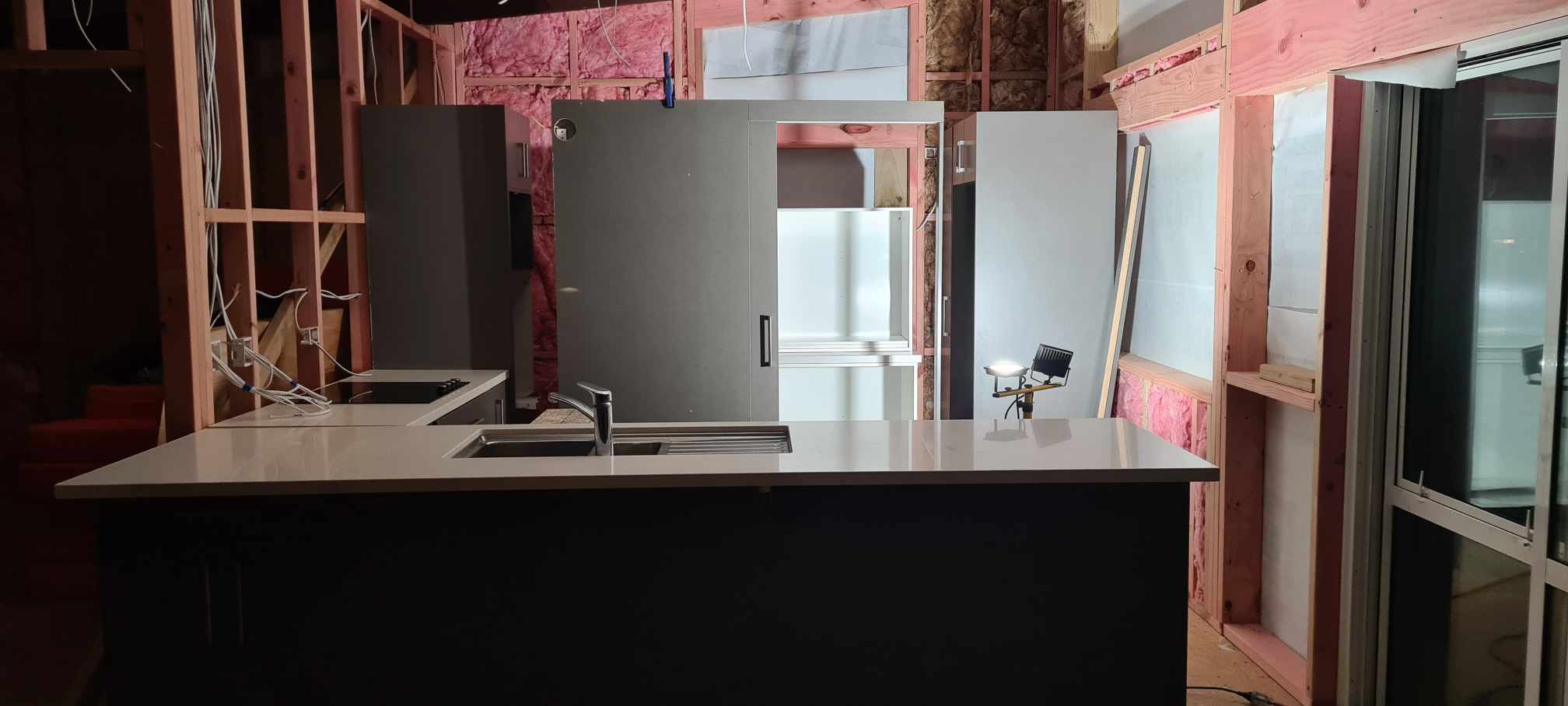 The donated kitchen placed in Dan's new home at Pukehina, ready to be fixed into place