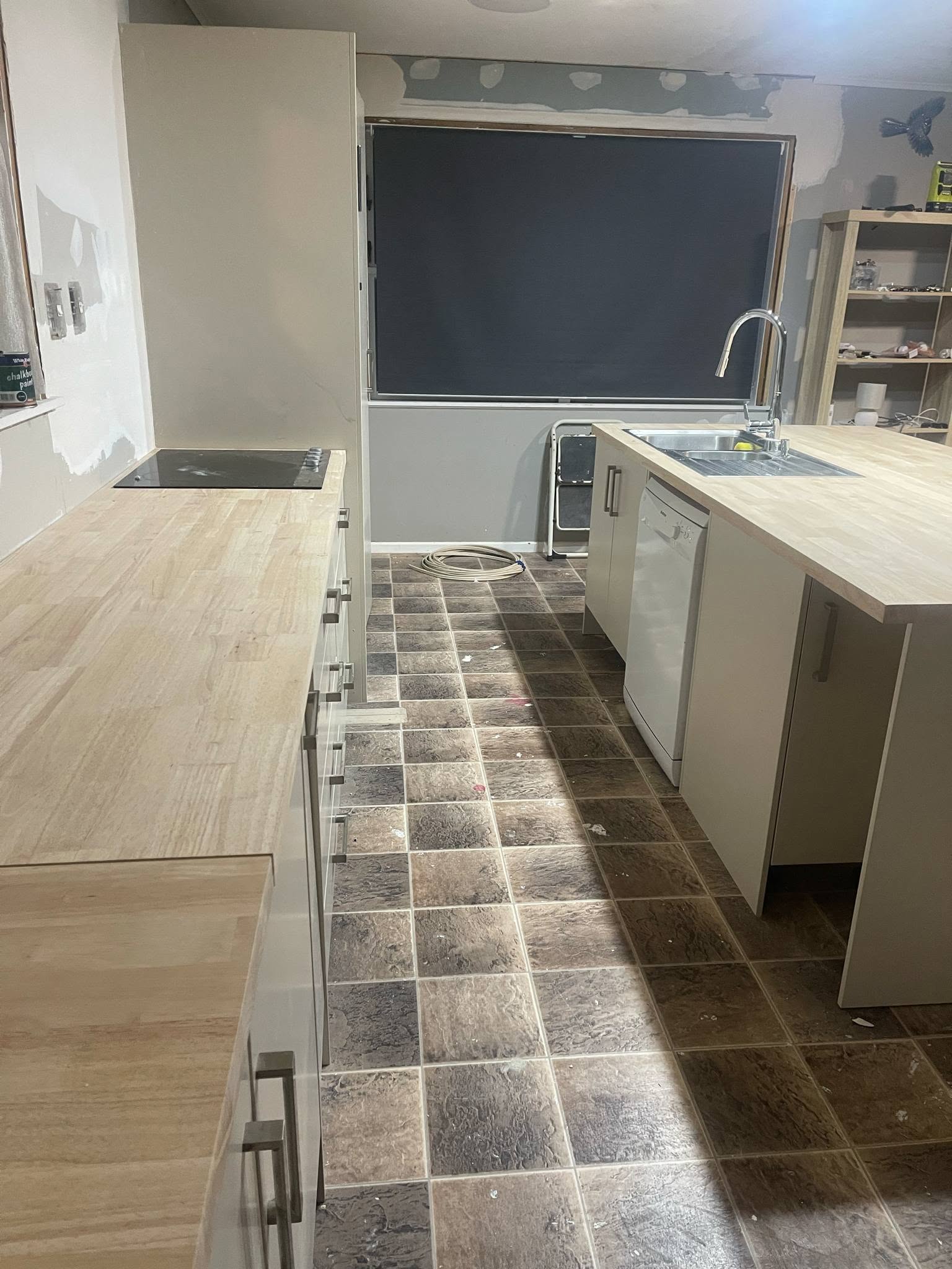 New cabinetry being installed mid-renovation